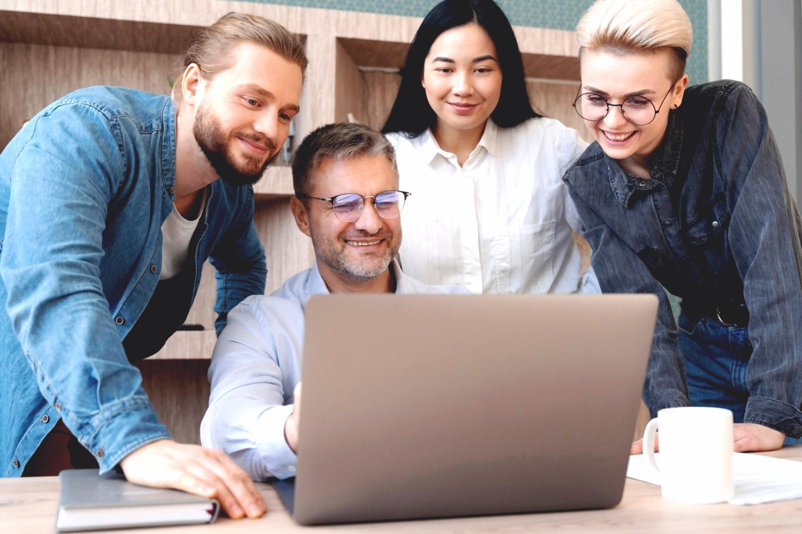 Professional financial analysis workspace with multiple monitors displaying statistical data and market trends